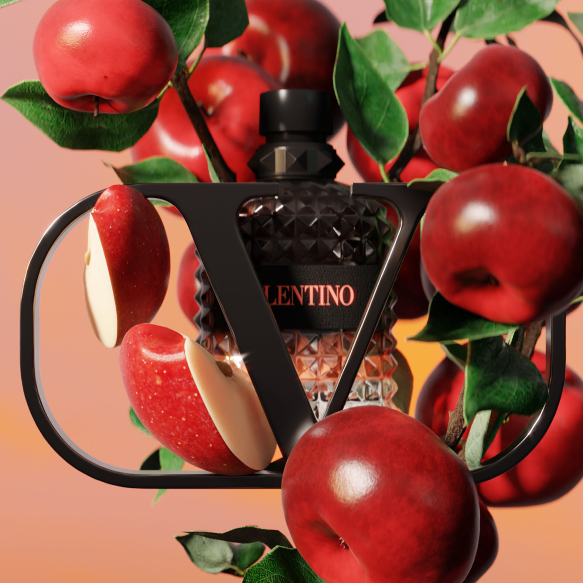 A bottle of Valentino perfume surrounded by red apples and green leaves, featuring a geometric black frame that highlights the product. The background gradient transitions from orange to pink.