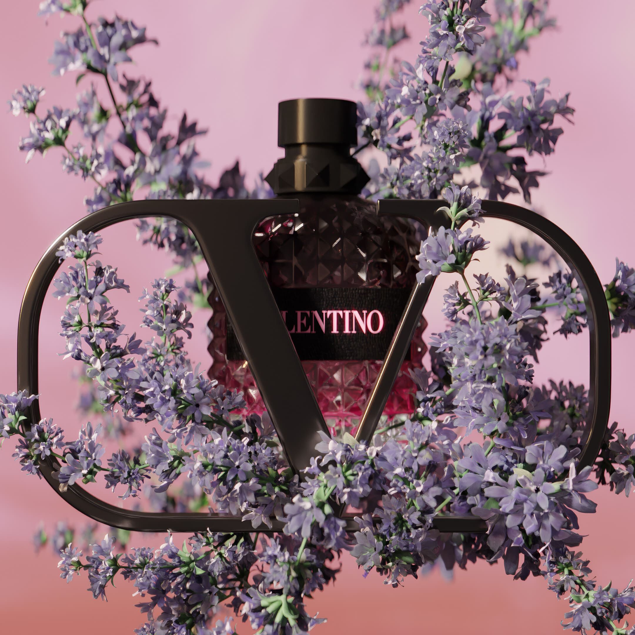 A stylish perfume bottle with a geometric design is framed by delicate purple flowers, set against a soft pink background. The label reads "Valentino."